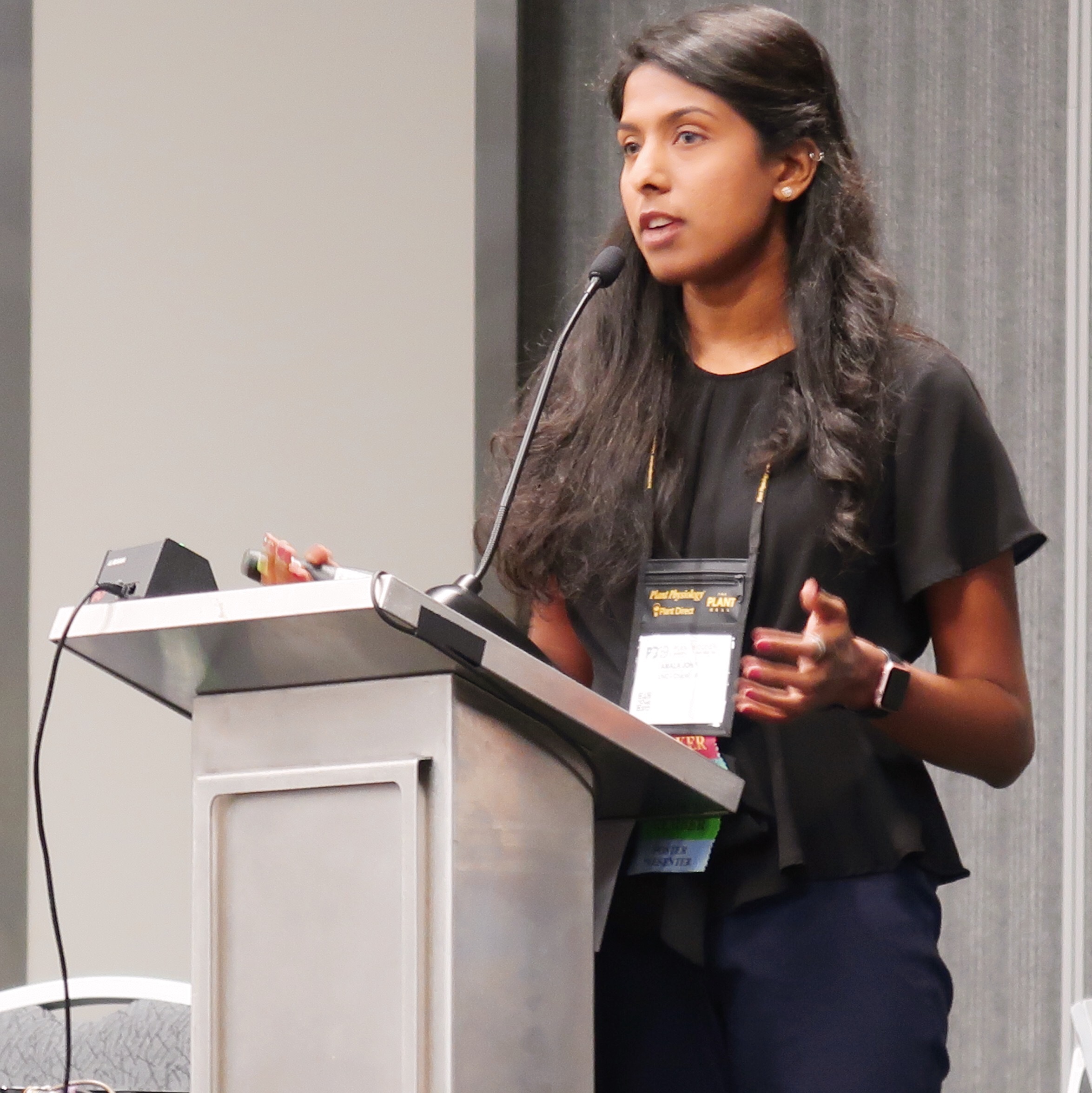 Amala John presenting research at a scientific conference